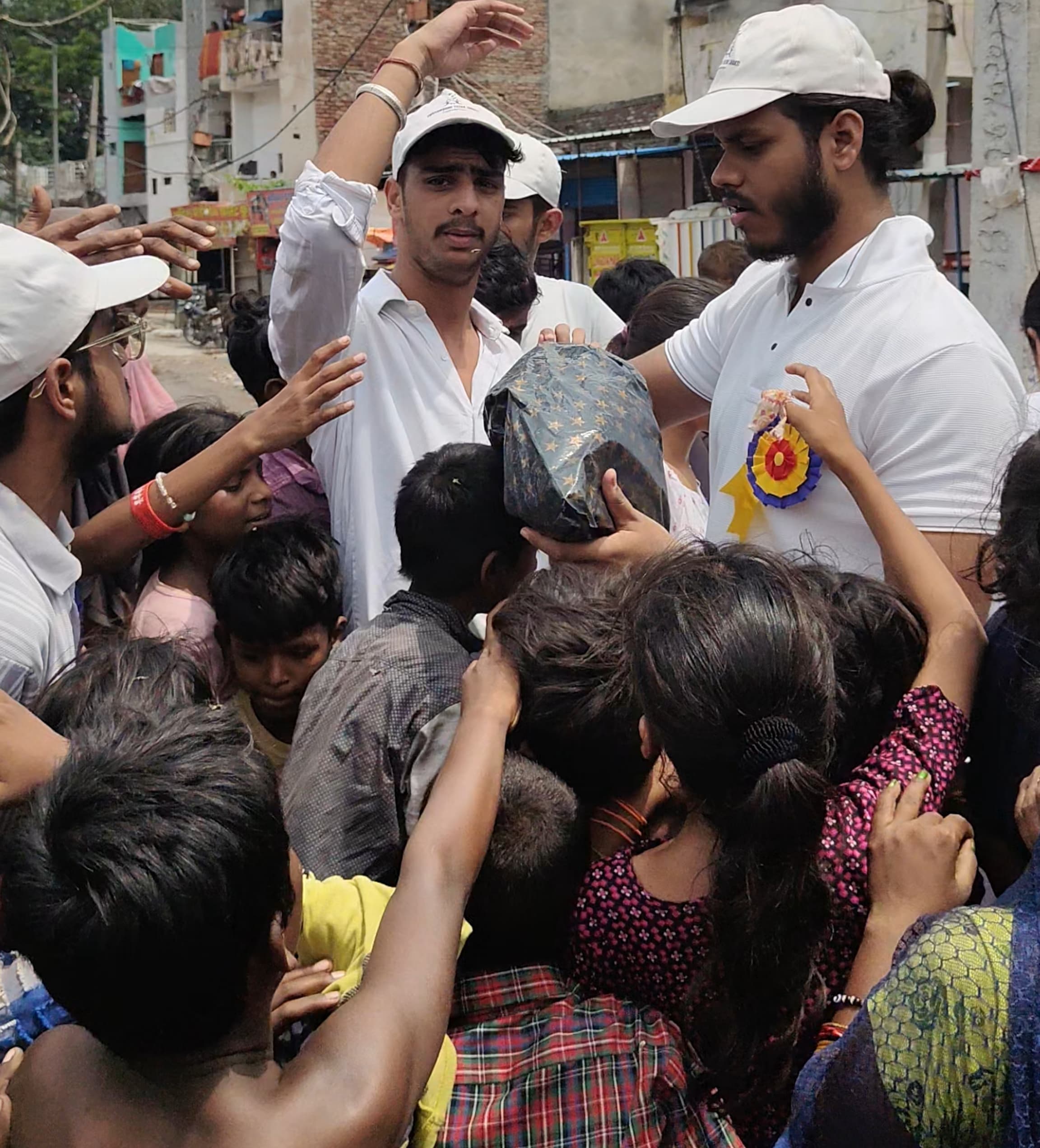 Volunteers distributing food packages to families